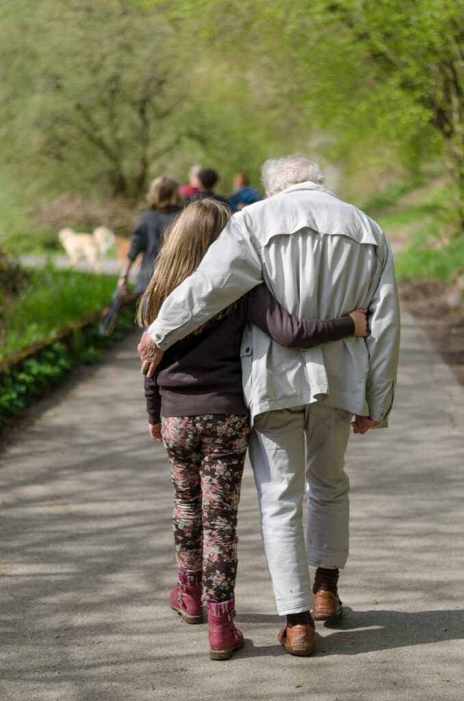 Older man and young child having a discussion, symbolizing the importance of including family wishes and discussions in planning.