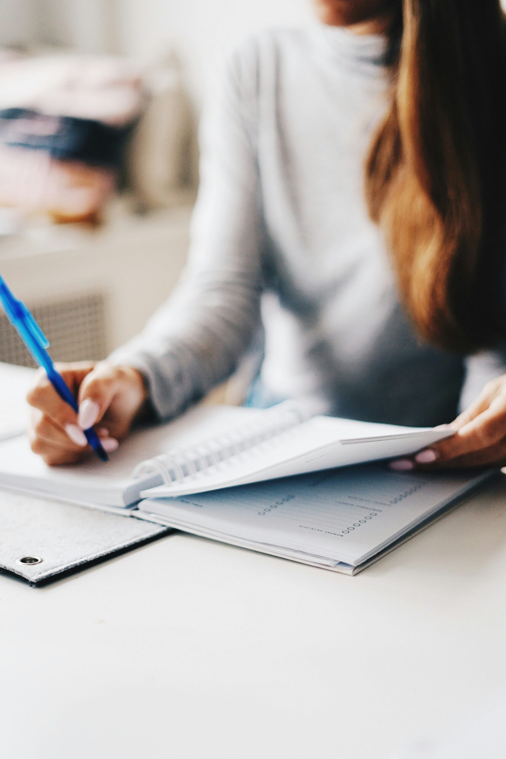 Young woman planning and budgeting with a laptop and financial documents