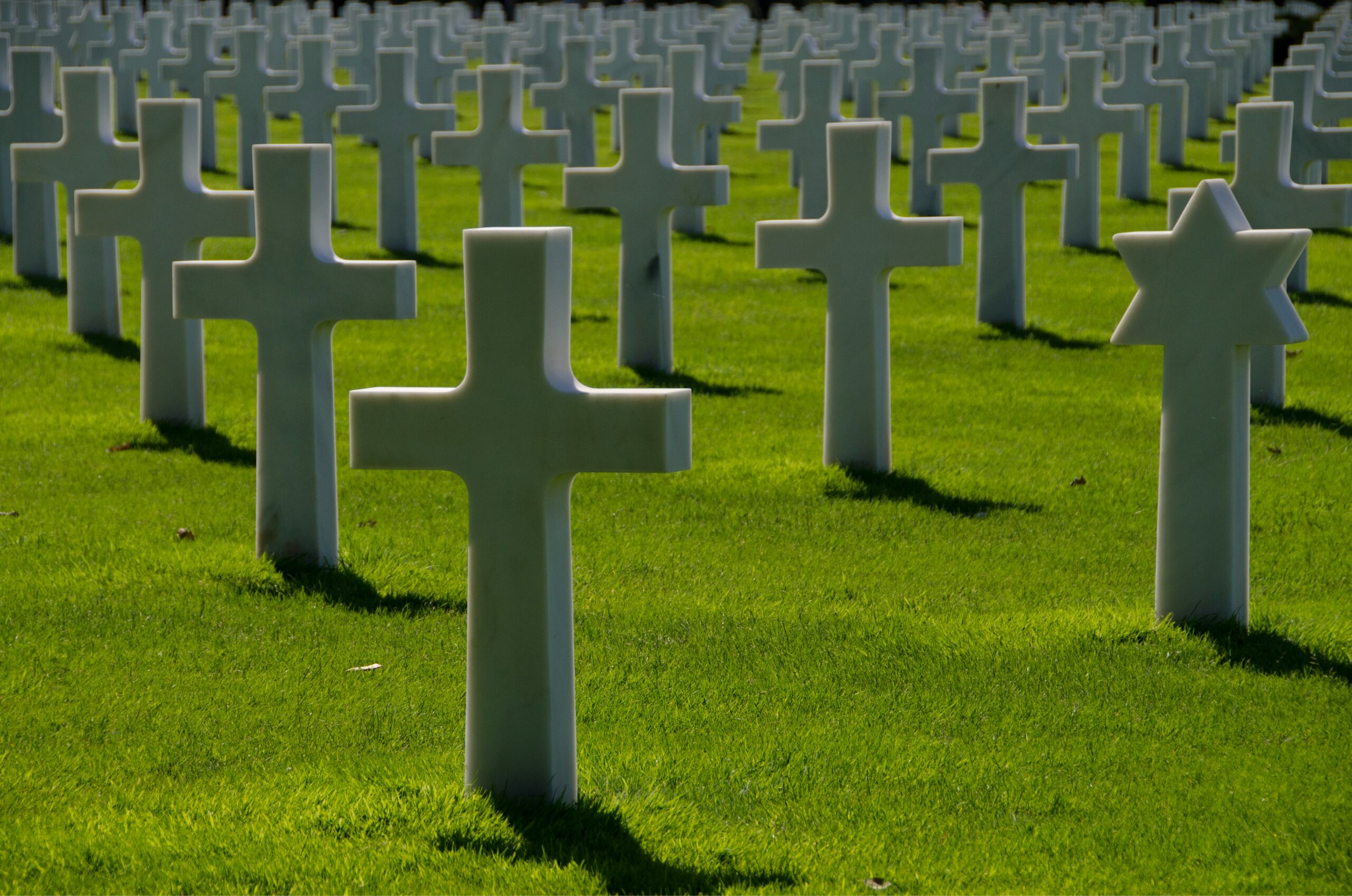 Row of cross tombstones in a cemetery