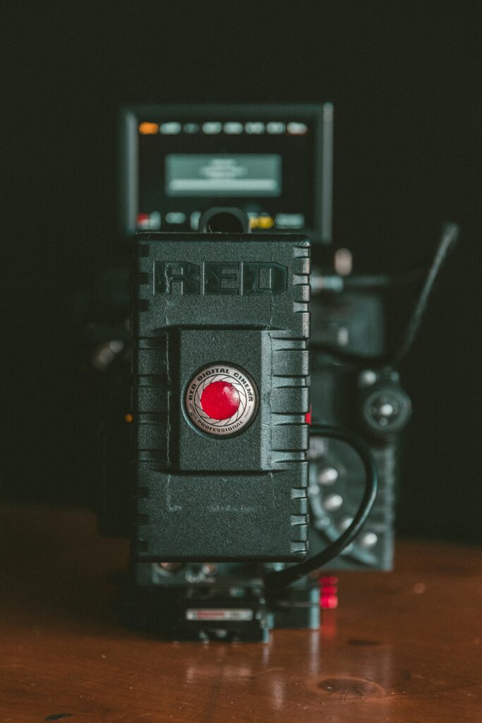 Camera setup for livestreaming a funeral, including camera, microphone, and lighting equipment.